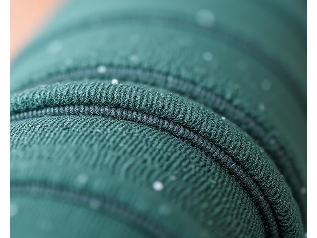 A close-up of a yoga bag made from recycled ocean plastic, with a subtle texture and sustainable label, showcasing conscious material use.